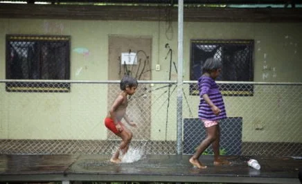 Two indigenous kids at play in their community