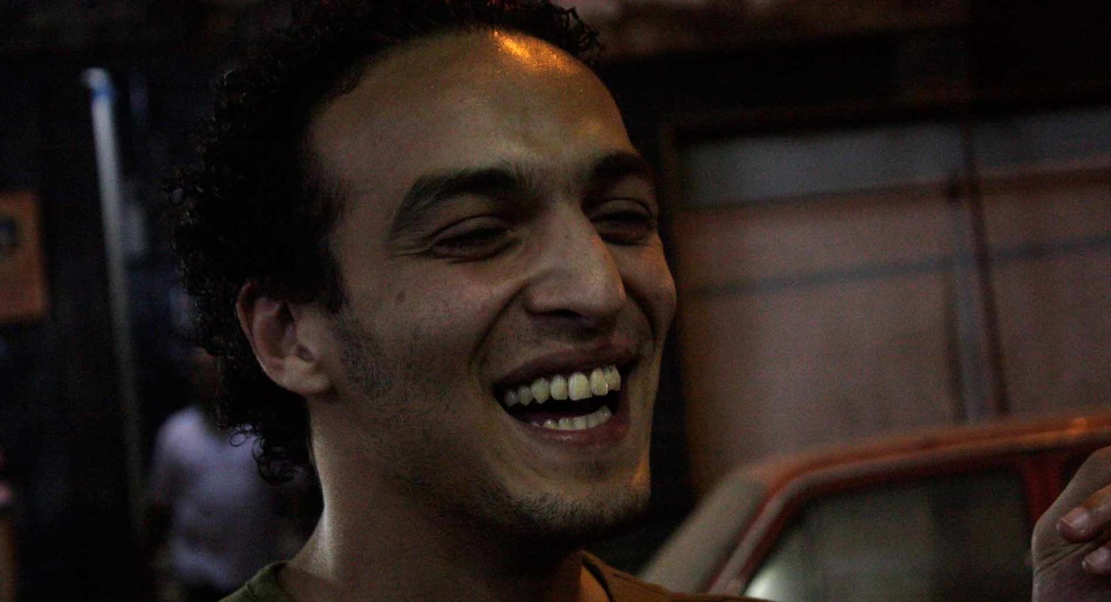 Mahmoud Abou Zeid, also known as Shawkan, laughs at the camera.