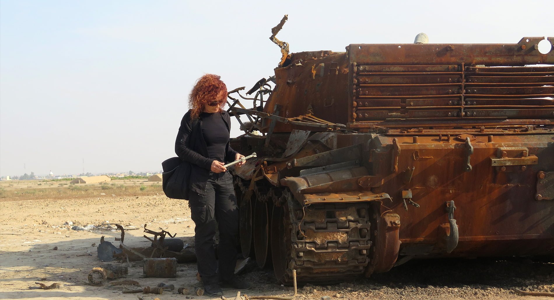 Donatella Rovera, Senior Crisis Adviser at Amnesty International examining remains of weapons near Amerli in Iraq.