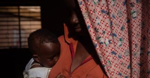 A woman and her child outside a refuge for survivors of rape, early and forced marriage in Burkina Faso