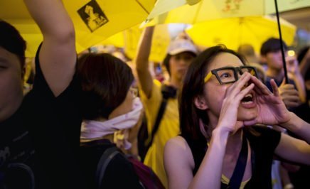 A pro-democracy protester shouts during a rally outside government headquarters in Hong Kong