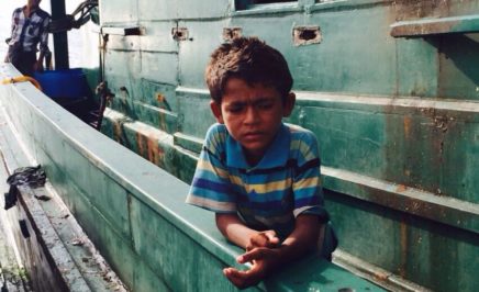 Rohingya child on boat at sea