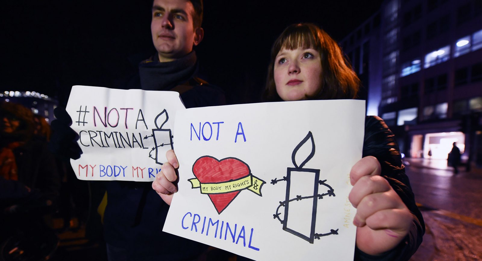 Two activists protest in support of a woman charged with miscarriage Northern Ireland