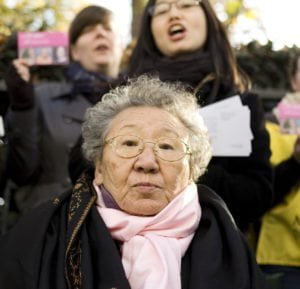 Gil Won Ok was promised factory work at the age of 13, but found herself in a comfort station in northeast China where she worked as a ‘comfort woman’. Gil broke her silence in 1998, 53 years after her traumatic experience. She said of the need to continue campaigning: "the Japanese Government thinks if all ‘comfort women’ die, it will be buried and forgotten…as long as our next generation knows about it, it will not be forgotten".