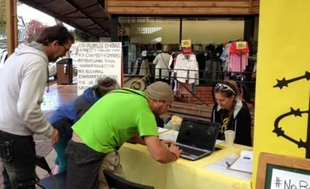 People sign up to the No Business in abuse campaign in Margaret River, WA.