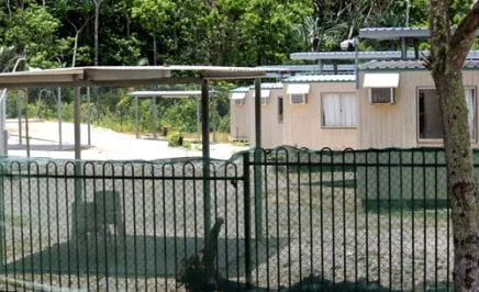 Fenced area with makeshift houses at the Phosphate Hill detention centre on Christmas Island, where children and families are detained
