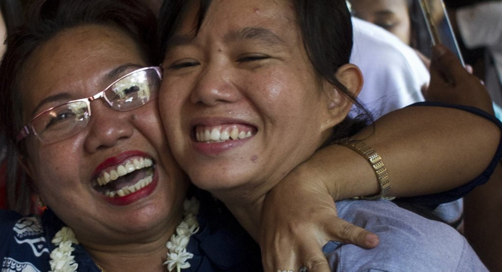 Family members welcome student protest leader Phyoe Phyoe Aung (R) as she arrives for a hearing at her trial in Tharrawaddy town, Bago Region in Myanmar on April 8, 2016. © YE AUNG THU/AFP/Getty Images