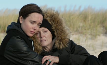 Ellen Page and Julianne Moore embrace on a beach