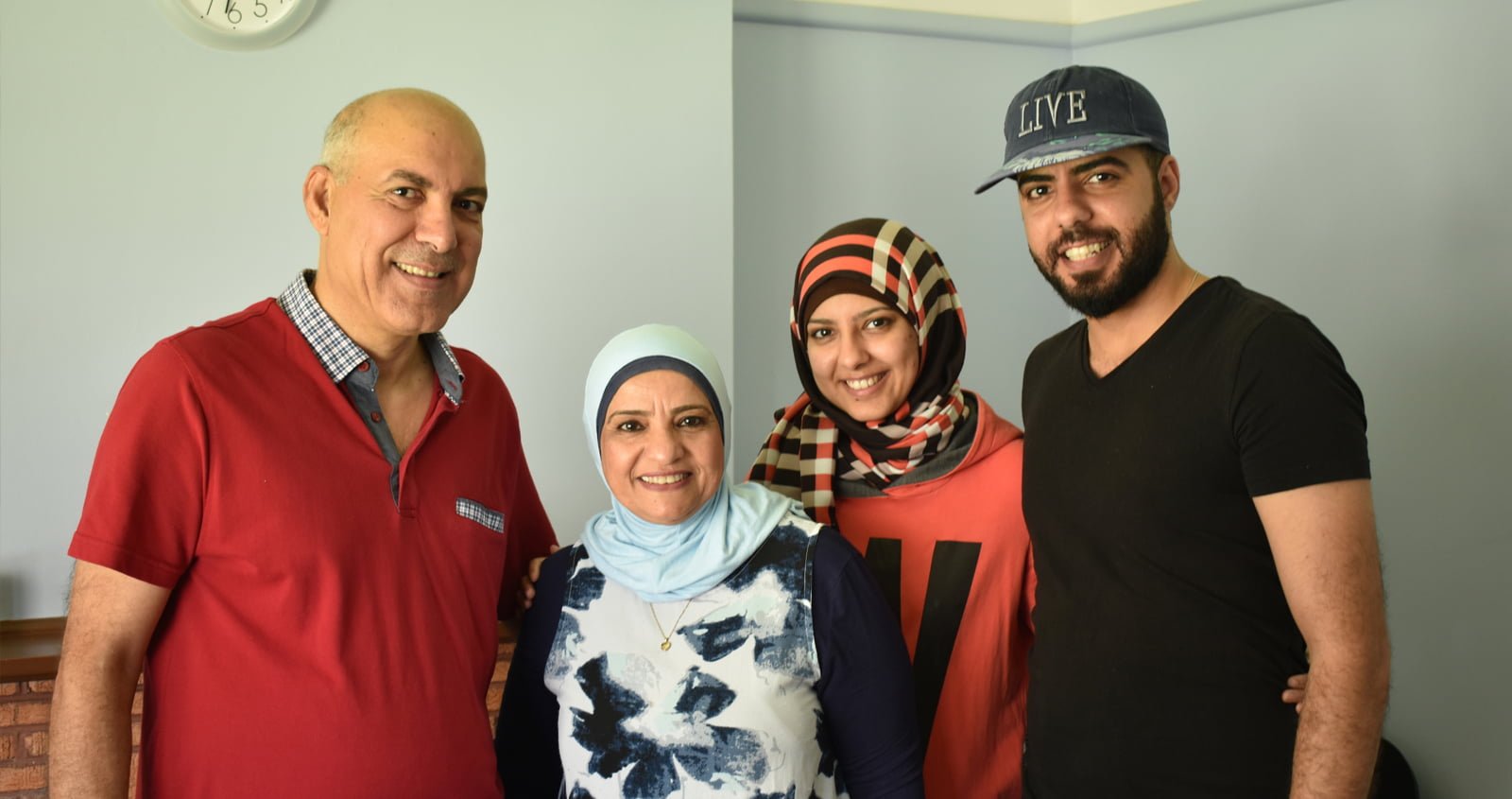 Four members of the Al Janabi family smiling