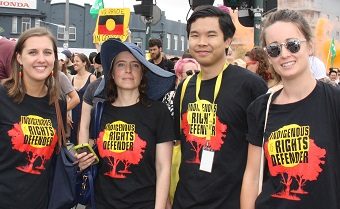 Activists wearing Indigenous rights defender tshirts at a Survival Day rally 2017