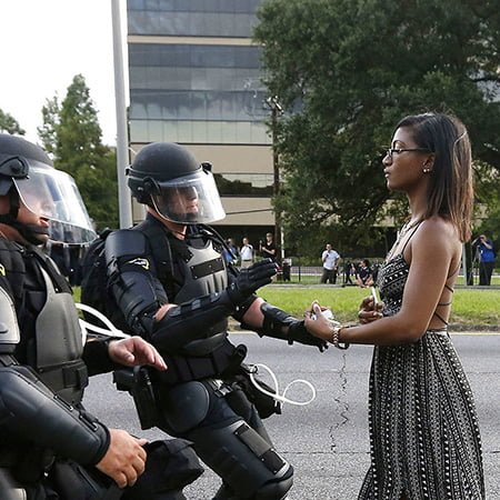 JULY 11 2016 SAVE PRINT LICENSE ARTICLE 'Remarkable' photo of woman facing riot police that may define Black Lives Matter Megan Levy Black Lives Matter reeling after police shootings Dallas shootings compound horror for Americans Who was Micah Johnson, the Dallas shooter? As the lone woman stood in front of a row of riot police in the US, her flowing dress and bare arms in sharp contrast to the officers' armour, she gave off an air of peaceful determination and defiance. Play Mute 0:00 / 0:00 Loaded: 0%Progress: 0% Fullscreen MORE WORLD NEWS VIDEOSPrevious slide Next slide null Black Lives Matter photo goes viral null Video duration 01:03 British actor's ISIL Ariana Grande revenge Myeshia Johnson kisses the casket of her husband, Sgt. La David Johnson during his burial service at Fred Hunter's ... Video duration 01:49 Widow says Trump call 'made me cry' Video duration 00:49 Toys 'R' Us collapse to hit Hasbro ... null Video duration 01:40 Five former US presidents join forces null Video duration 02:13 I don't know how to get through to you: ... null Video duration 01:44 Japanese election risk pays off for Abe null Video duration 01:12 Tillerson: militias in Iraq should 'go ... MORE VIDEOS Black Lives Matter photo goes viral The image of a lone woman in a dress standing up to riot police at a protest in Baton Rouge is being hailed as 