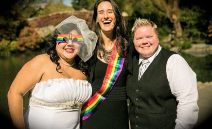 People stand in front of the camera with LGBTQI+ colours on for the Queer ME picnic