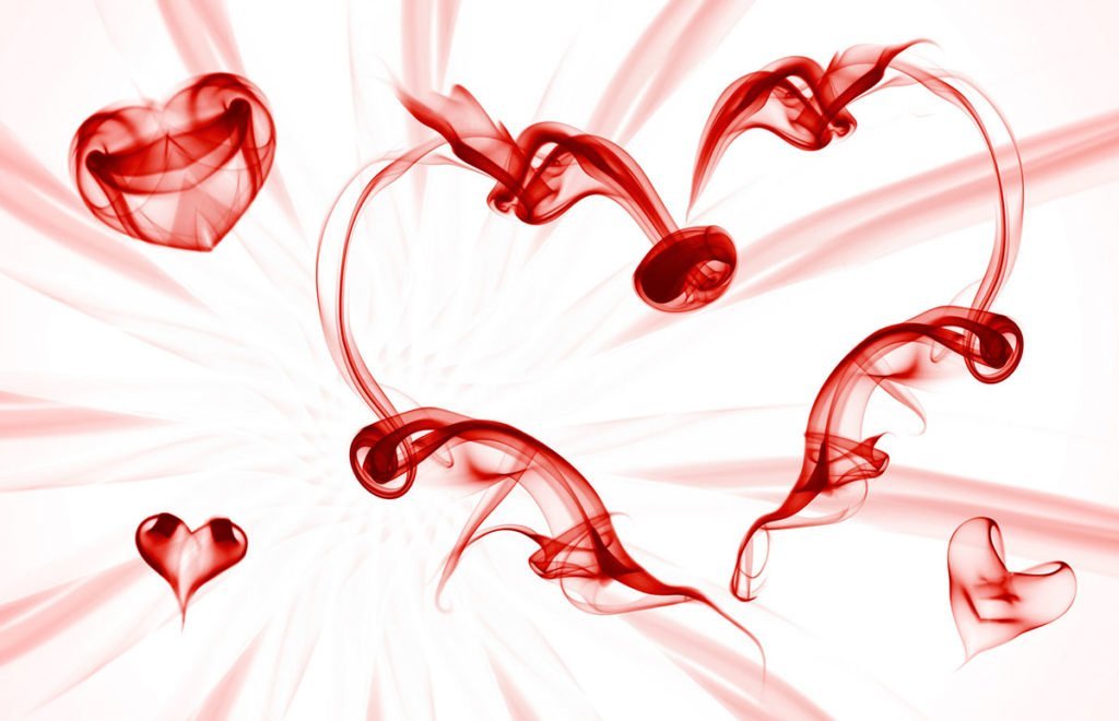 Swirls of red shaped into hearts on a white background
