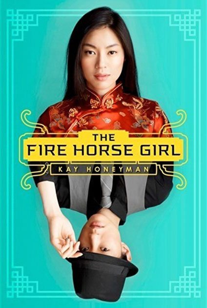 Front cover of the novel The Fire Horse Girl. The cover features two girls, one in traditional Chinese dress and one dress in men's clothing and wearing a hat. They are mirror images of each other and set on a blue background.