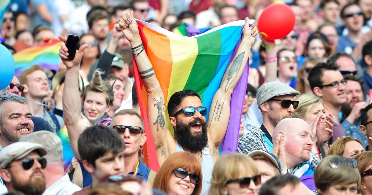 Crowd with rainbow flags