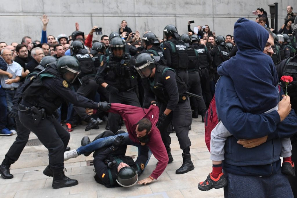 SPAIN: National Police force's Police Intervention Unit and Civil Guard officers used excessive force against demonstrators who were passively resisting in the streets and at the entrances to polling stations.