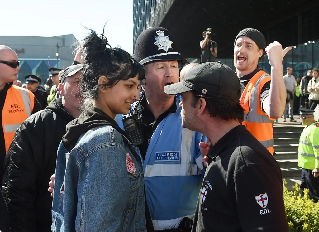 UK: In a symbol of Birmingham’s defiance of the far-right, Saffiyah Khan (left) took a stand against English Defence League (EDL) protester Ian Crossland.