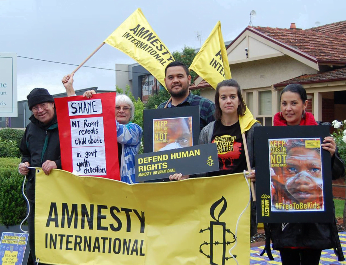 South Australian Activists outside Federal Minister Christopher Pyne's office with Amnesty banners and flags & posters calling for a National Plan of Action for Community is Everything campaign (Indigenous Youth Justice)