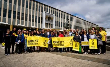 (c) AIA/ Benjamin Murphy: Amnesty ACT activists, MLAs, refugees and staff celebrate ACT community sponsorship motion.