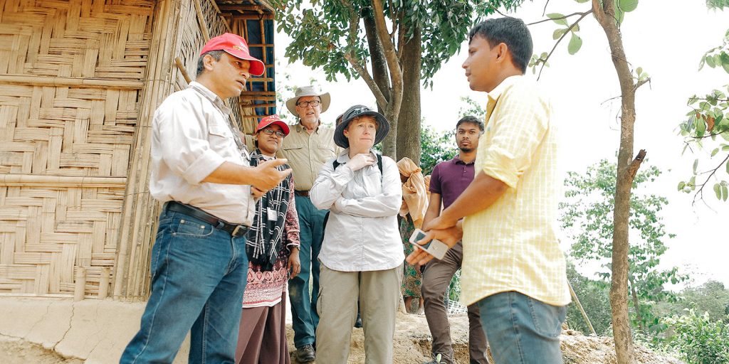 Dr Stephen Moss (background) and Amnesty International Australia National Director (foreground) speak with Rohingya refugees in Bangladesh