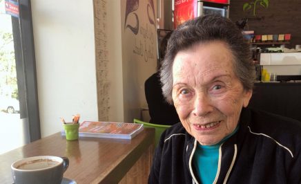 Elderly woman in a cafe