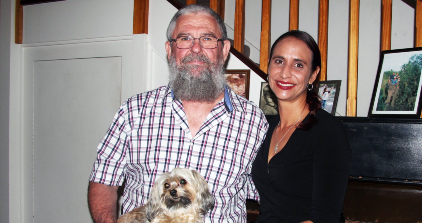 Dieter (left) with family dog on his lap, sitting next to Tammy (right).