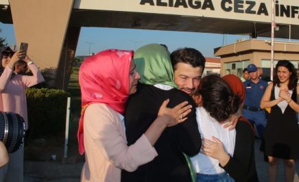 Taner Kilic embracing his family
