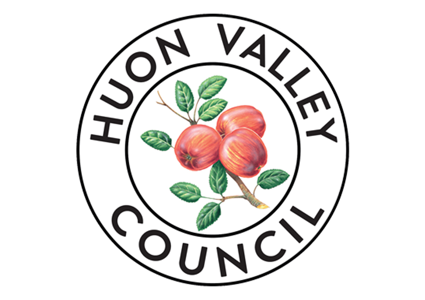 Illustrated orange fruit and green leaves encircled by black text saying Huon Valley Council