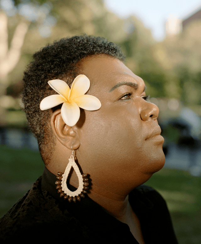 A portrait of Amasai Jeke wearing a Frangipani behind her ear at The Peoples' Summit on Climate, Rights and Human Survival, New York, USA, 18 September, 2019.