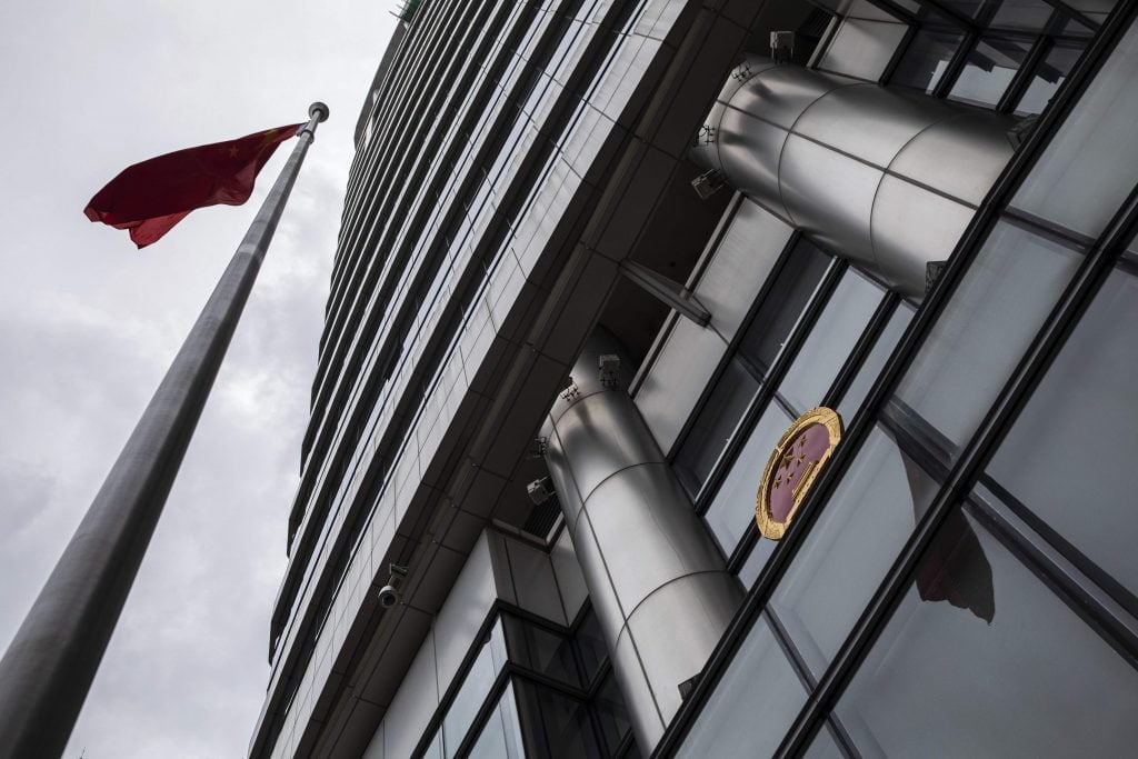 Image depicts a view from the ground of the grey office for Safeguarding National Security in Hong Kong.