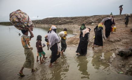 The relocation of Rohingya refugees as they cross a river