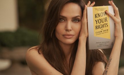 Angelina Jolie with the book 'Know Your Rights and Claim Them'