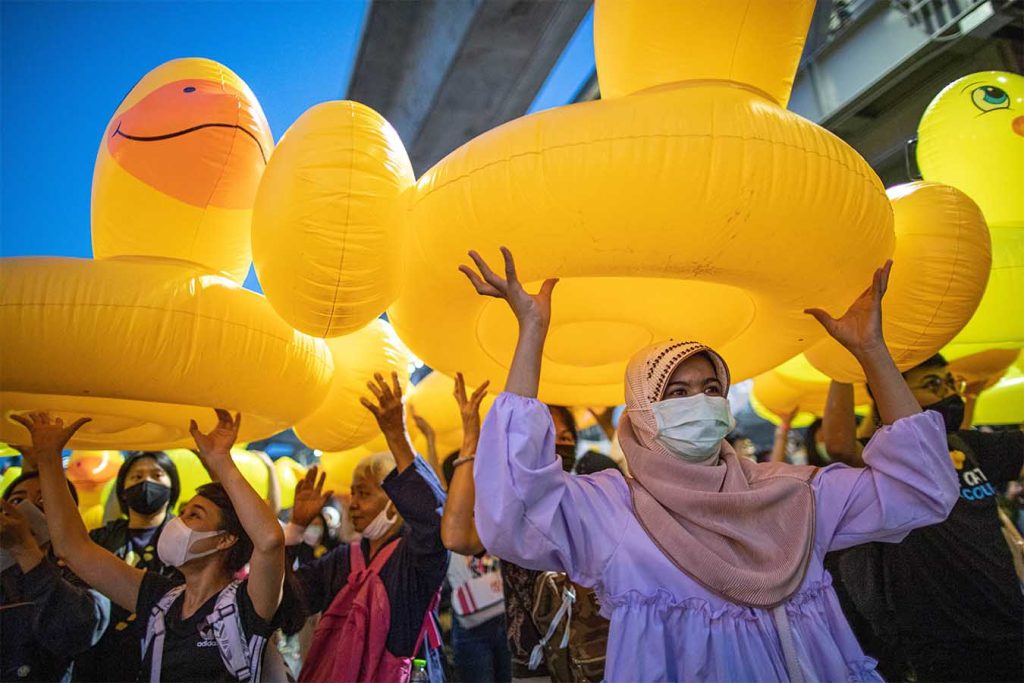 Protesters holding up giant rubber ducks in Thailand