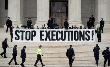 Police officers gather to remove activists during an anti death penalty protest in front of the US Supreme Court