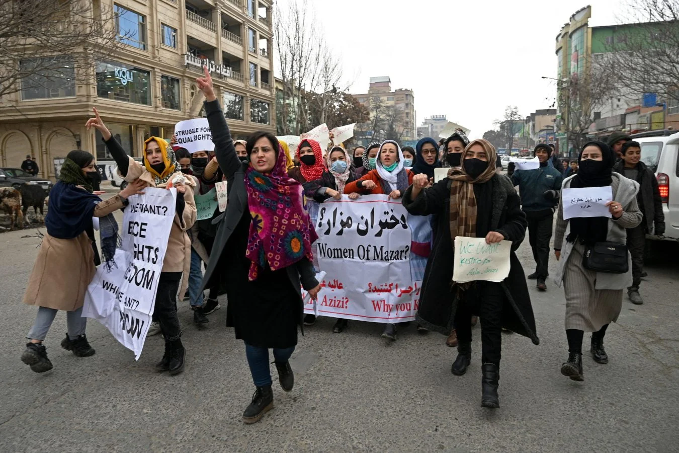 Afghan women protesting, chanting slogans and holding banners for their rights