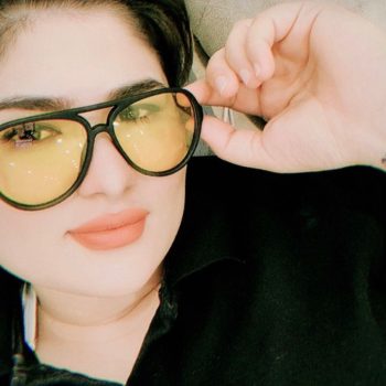 Selfie of LGBTI Rights Defender Zahra Sedighi Hamadani in a black t-shirt, wearing black framed glasses