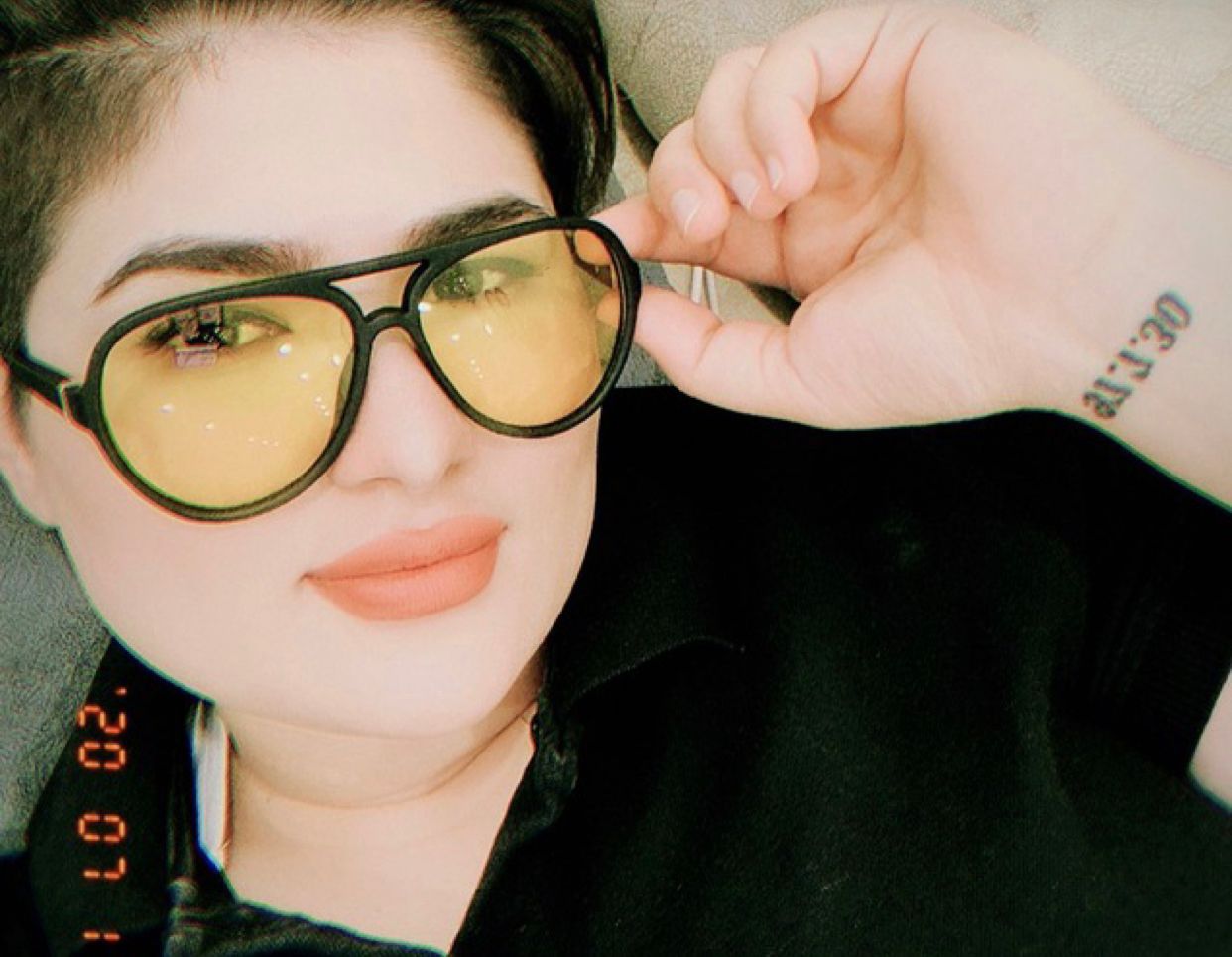 Selfie of LGBTI Rights Defender Zahra Sedighi Hamadani in a black t-shirt, wearing black framed glasses