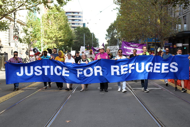 Protestors advocating towards justice for refugees in order to signify Refugee Week.