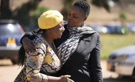 Joanah Mamombe and Cecillia Chimbiri embracing each other joyously