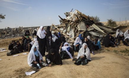 Bedouin women sit next to the ruins of their demolished houses in the unrecognized Bedouin village of Umm Al-Hiran, in the Negev desert, Israel, January 18, 2017. A resident and an Israeli policeman were killed during the operation. Israeli authorities said the policeman was killed in a car-ramming attack, while residences and activists claimed the driver was first shot dead by the police, with no apparent reason, before losing control of his car and driving towards the policemen. The Israeli state plans to completely demolish the village in order to build a Jewish-only town on that land.