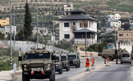Israeli armoured vehicles are seen at the checkpoint at the northern entrance of Huwara near Nablus in the occupied West Bank.