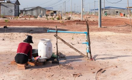 In this photo from July 2023 a resident washes her clothes using one of the water pumps installed by authorities for households at the Run Ta Ek resettlement site.