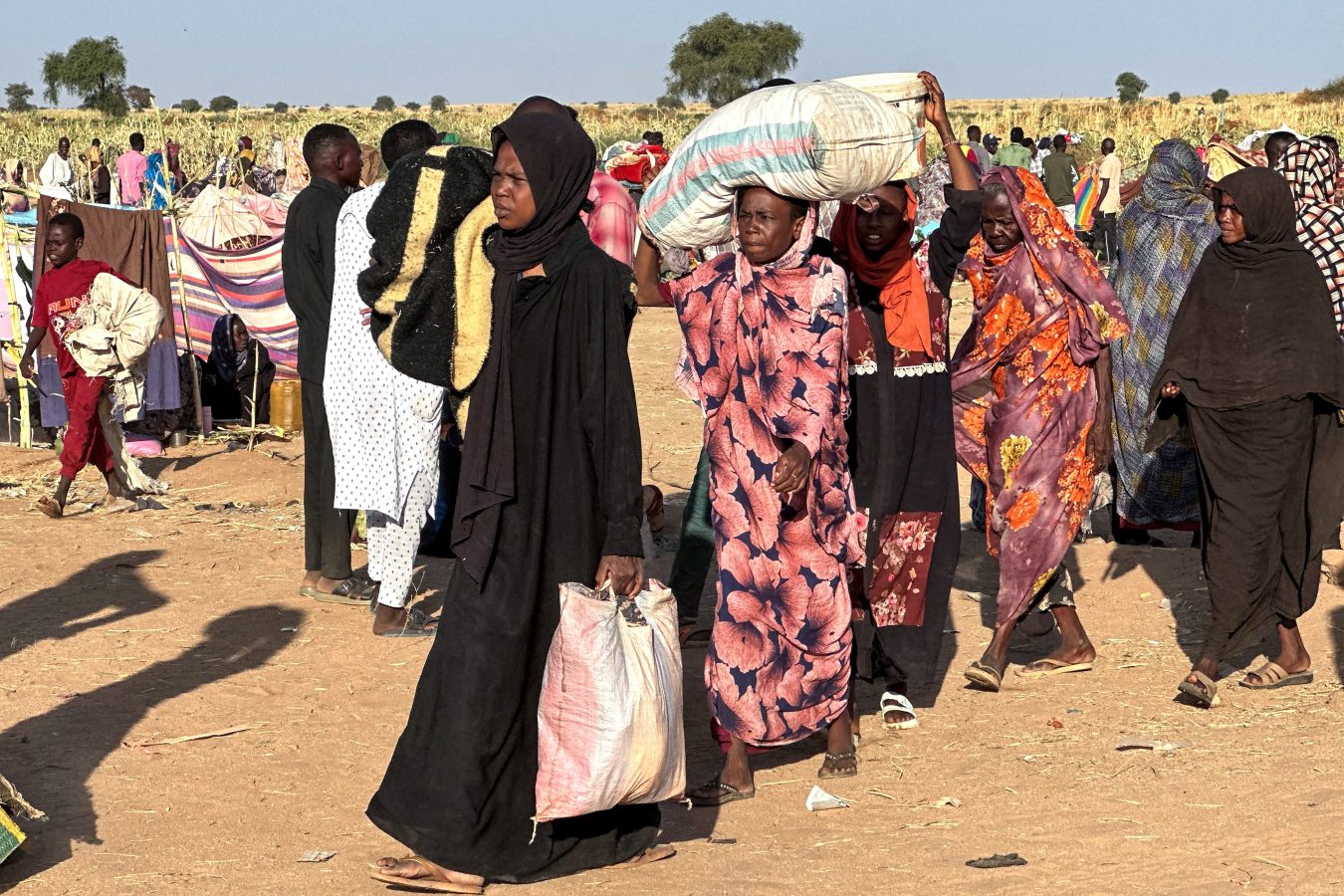 Displaced Sudanese who fled El-Fasher after the city fell to the Rapid Support Forces (RSF), arrive in the town of Tawila war-torn Sudan's western Darfur region on October 28, 2025. Fears mounted in Sudan on October 28, three days after paramilitaries seized the key city of El-Fasher, amid reports of mass atrocities and the killing of five Red Crescent volunteers in Kordofan. The capture of El-Fasher, the historic heart of Darfur, has sparked fears of mass killings reminiscent of the region's darkest days. (Photo by AFP) (Photo by -/AFP via Getty Images)