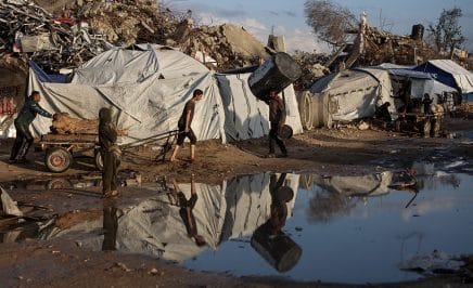 A displaced Palestinian man pulls a cart after heavy rain in Jabalia city, northern Gaza Strip, on November 25, 2025. The Gaza Strip has been largely reduced to rubble after two years of fighting, sparked by Hamas's attack on Israel on October 7, 2023, which resulted in the deaths of 1,221 people. Israel's retaliatory assault on Gaza has killed at least 69,733 people, according to figures from the health ministry that the UN considers reliable.