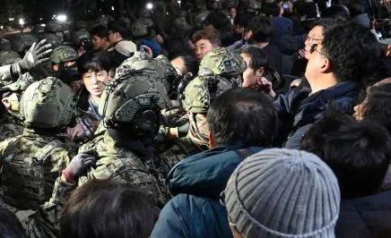 Soldiers try to enter the National Assembly building in Seoul on December 4 2024, after South Korea President Yoon Suk Yeol declared martial law. South Korea's President Yoon Suk Yeol on December 3 declared martial law, accusing the opposition of being 