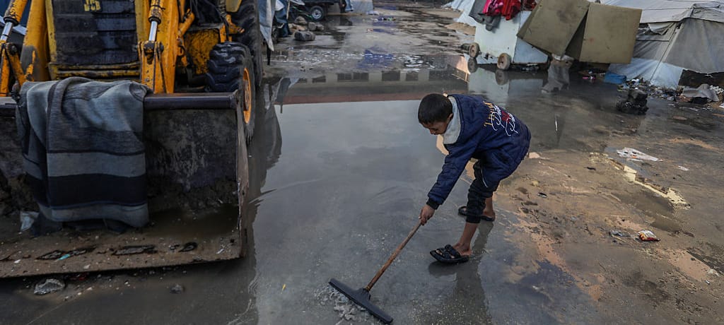 KHAN YUNIS, GAZA - DECEMBER 16: Palestinians struggle with flooding after heavy rain hits the Khan Yunis, Gaza on December 16, 2025. The damaged tents, already vulnerable due to harsh winter conditions, further worsened living conditions for civilians struggling to survive in cold and difficult circumstances. (Photo by Abed Rahim Khatib/Anadolu via Getty Images)