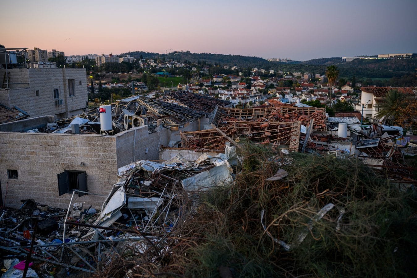 BEIT SHEMESH, ISRAEL - MARCH 02: The sun rises over the area destroyed by an Iranian missile yesterday on March 02, 2026 in Beit Shemesh, Israel. At least nine people were killed and over 20 injured in the strike. Iran fired waves of missiles at Israel after the United States and Israel launched a joint attack on Iran early on February 28th. Israel's Defense Minister Israel Katz declared a state of emergency, as Israelis braced for the retaliation. (Photo by Alexi J. Rosenfeld/Getty Images)