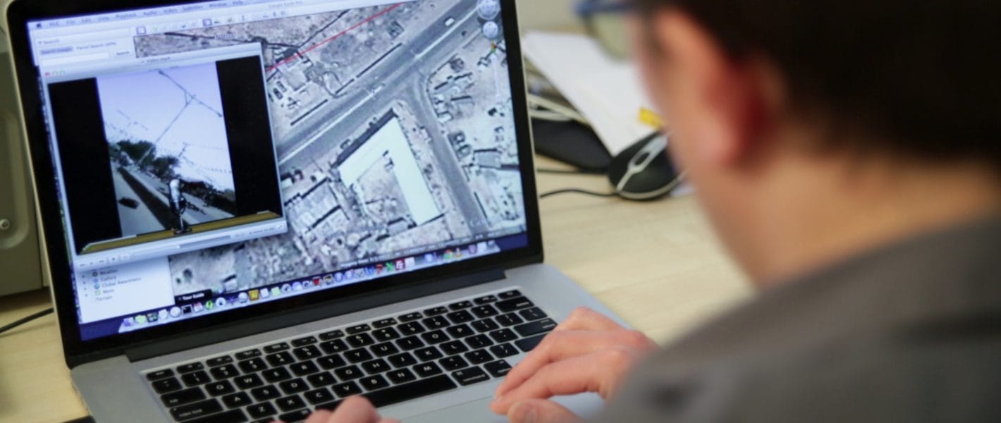 Pictured: Christoph Koetti, Founder and Editor of Amnesty's Crisis Evidence Lab verifying footage of human rights violations.