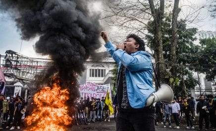 TOPSHOT - A demonstrator shouts slogans during a protest demanding police reform and the dissolution of the parliament, in Bandung, West Java on September 1, 2025. Thousands rallied across Indonesia on September 1, as the military was deployed in the capital after six people were killed in nationwide protests sparked by anger over lavish perks for lawmakers. (Photo by Timur Matahari / AFP) (Photo by TIMUR MATAHARI/AFP via Getty Images)